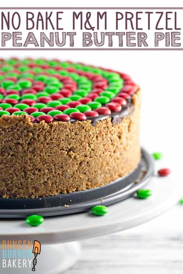 No Bake M&M’S® Pretzel Peanut Butter Pie: crispy pretzel crust, smooth whipped peanut butter filling, rich chocolate ganache, and crunchy M&Ms combine into the perfect easy pie. Perfect for holiday entertaining! #bunsenburnerbakery #peanutbutterpie #pie #pretzelcrust #christmas