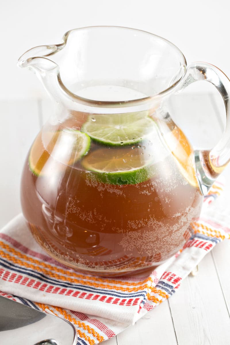 glass pitcher filled with a winter-themed champagne punch.