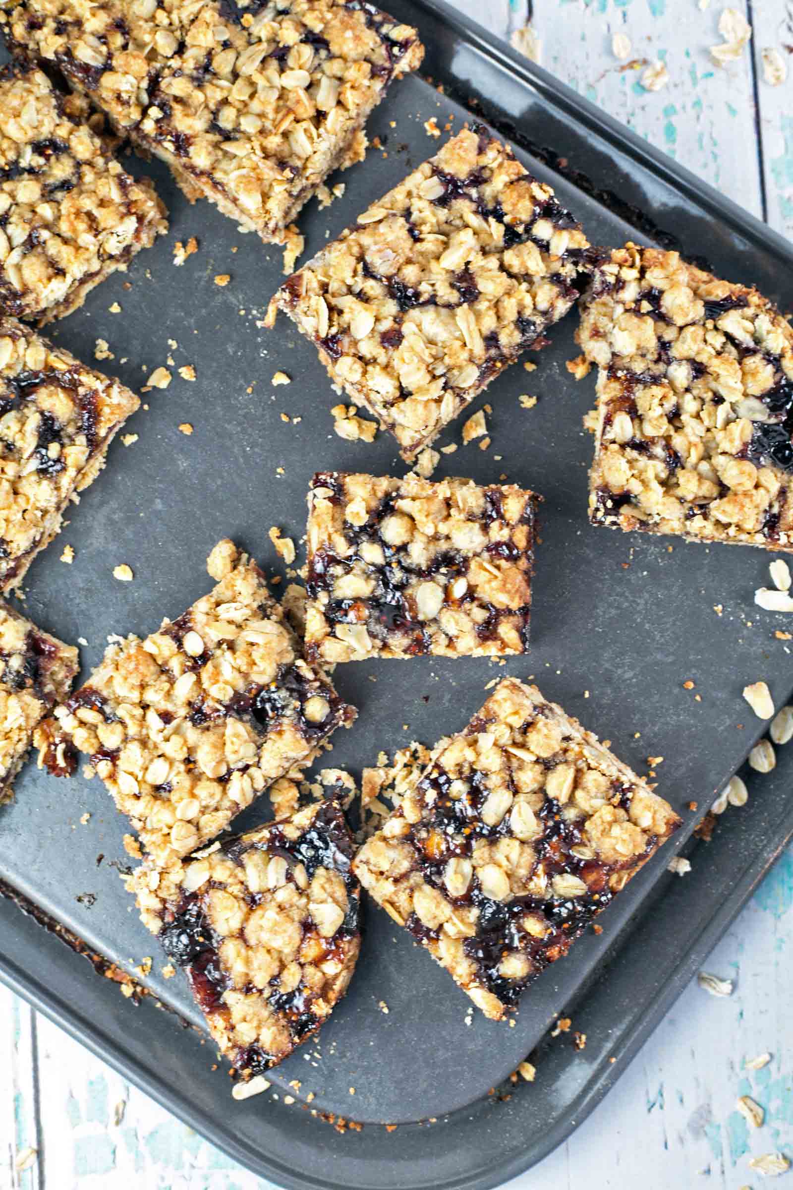 Oatmeal Jam Bars: one bowl, one spoon, mix by hand fruit bars. Oatmeal shortbread crust, a layer of jam, and an oatmeal crumble topping. Make ahead - freezer friendly! {Bunsen Burner Bakery}