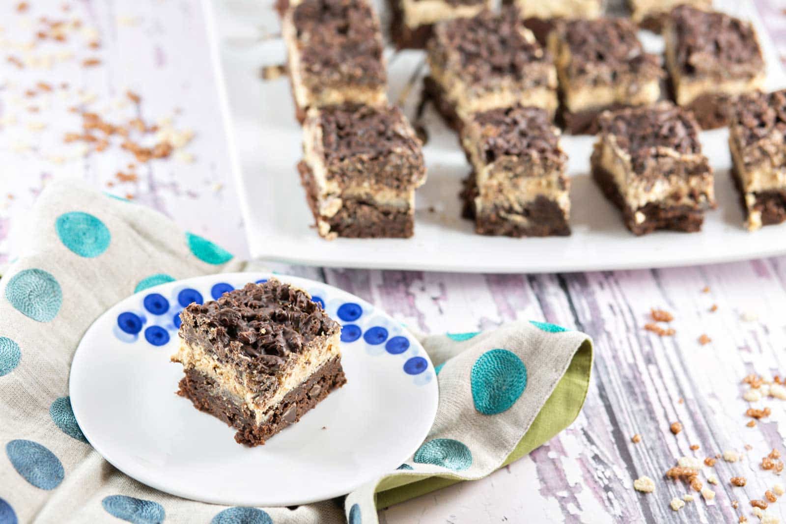 Peanut Butter Crunch Brownies: homemade brownies, peanut butter ganache frosting, and a Rice Krispie chocolate crunch layer - the perfect make-ahead party treat! {Bunsen Burner Bakery}