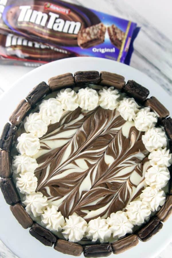 swirled chocolate and vanilla top of a tim tam cheesecake