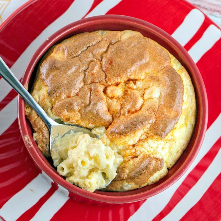 bowl of macaroni and cheese souffle with a spoon in it