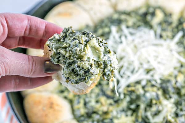 Up your spinach and artichoke dip game with this spinach and artichoke biscuit skillet - flaky biscuits surrounding bubbling hot dip! #bunsenburnerbakery #appetizers #dip #superbowl #partyfood