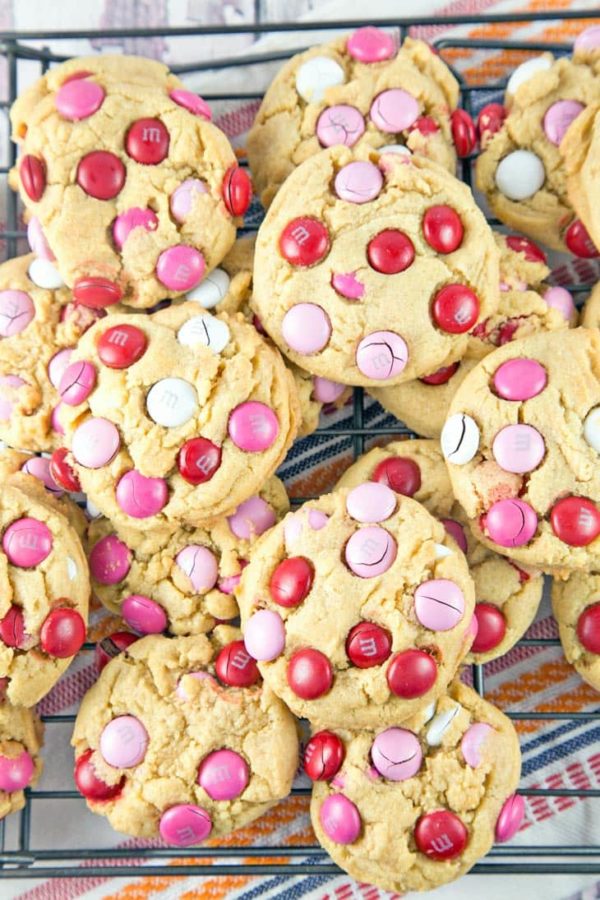 a pile of cookies on a cooling rack.