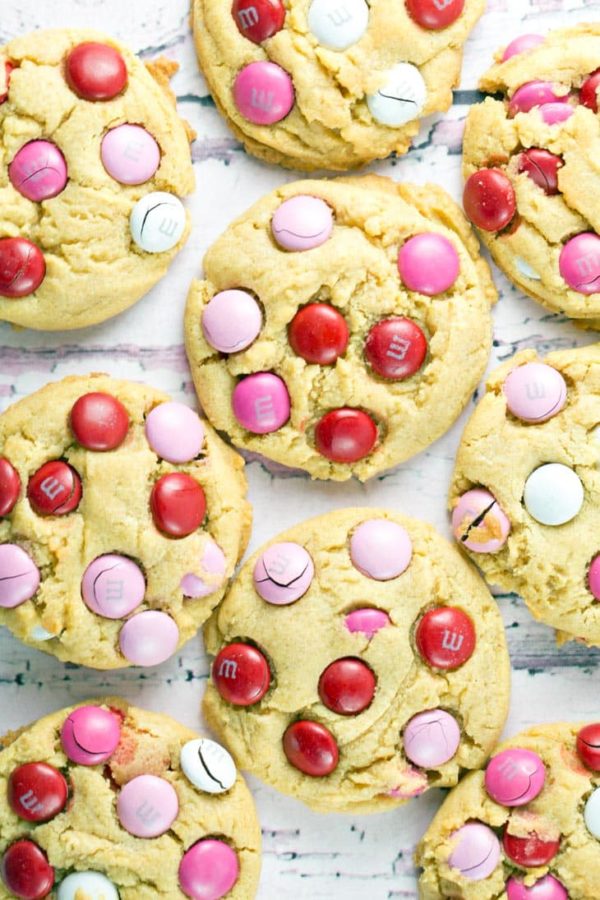 closeup overhead view of vanilla cookies covered with colorful M&Ms.