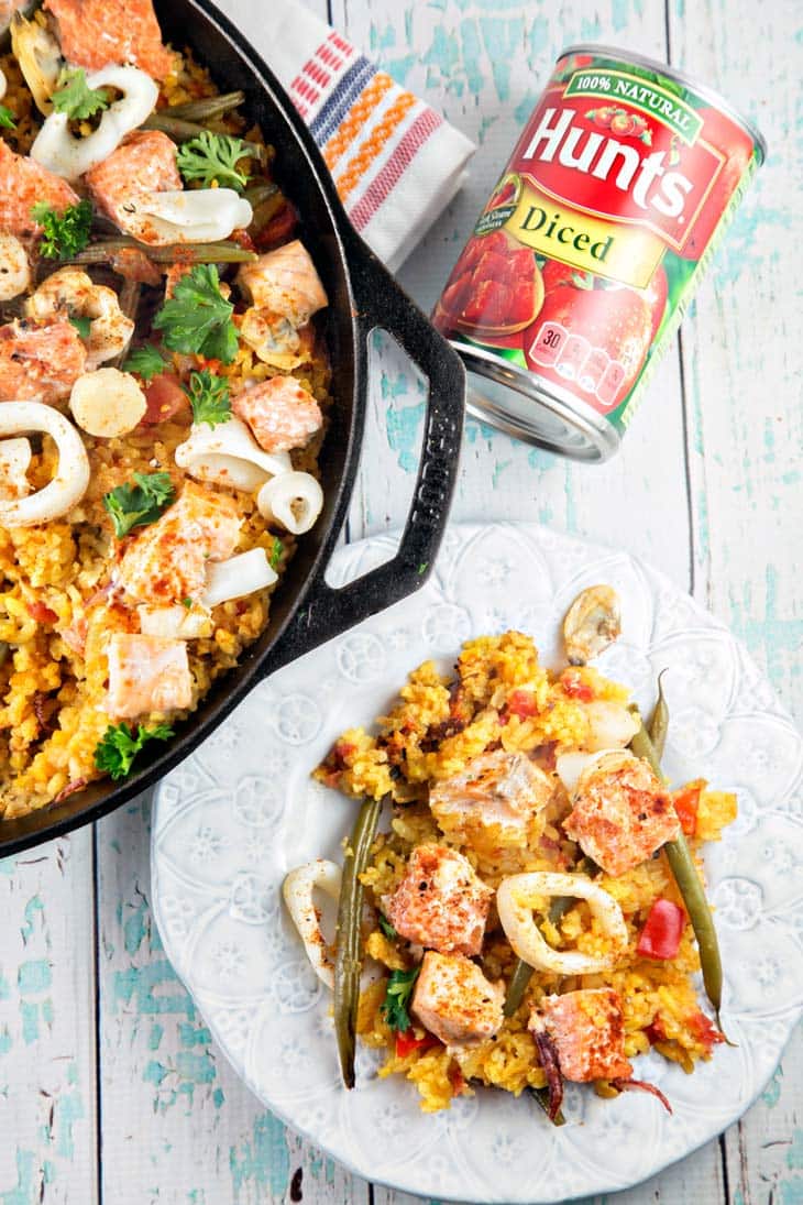 One Pan Salmon Paella: Tired of boring salmon? Try something new and different with one pan salmon paella. Made with easy-to-find ingredients, this is a delicious, heart-healthy dinner choice. {Bunsen Burner Bakery}