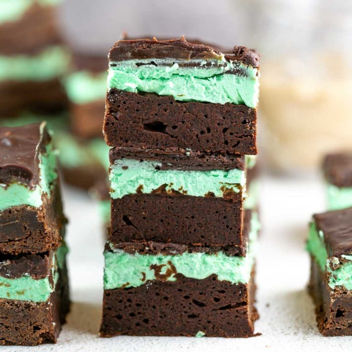 Mint Irish Cream Brownies: an easy from scratch fudgy brownie recipe covered with a layer of mint Baileys Irish cream frosting and topped with chocolate ganache. Perfect for St. Patrick's Day - or year round! #bunsenburnerbakery #brownies #irishcream #spatricksday
