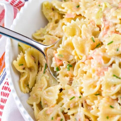 a big bowl of pasta in a creamy egg yolk sauce with smoked salmon.