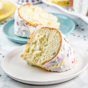 two thick slices of bundt cake covered in a lavender glaze
