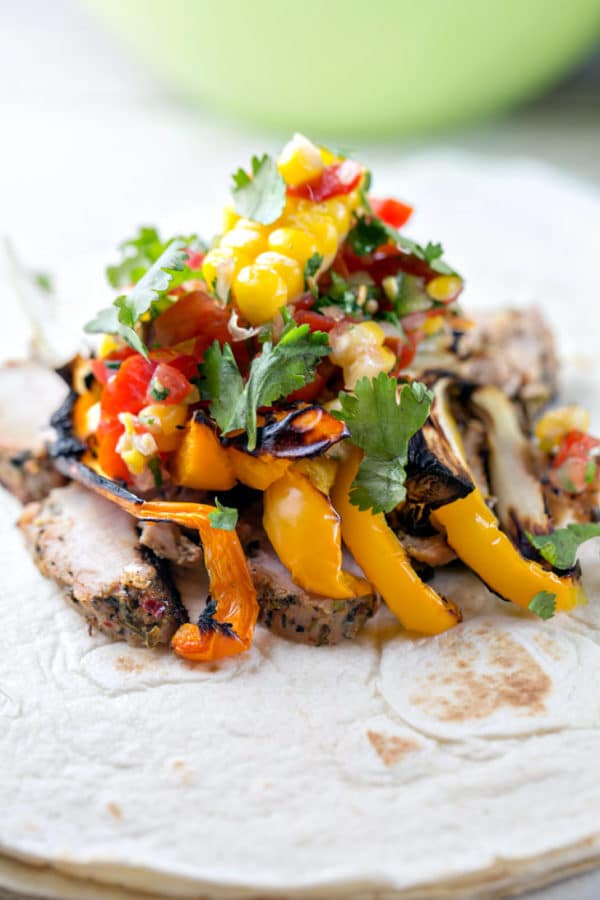 Grilled Pork Tenderloin Wraps: tuscan herb pork tenderloin with grilled peppers and onions and a homemade corn salsa wrapped in a corn tortilla. Perfect for dining on the go - great for picnics and packed lunches! {Bunsen Burner Bakery}