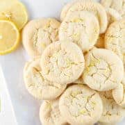 Lemon Sugar Cookies: perfectly soft and chewy, these cookies are made with 100% real lemon - no lemon cake mix or pudding. #bunsenburnerbakery #cookies #sugarcookies #lemon