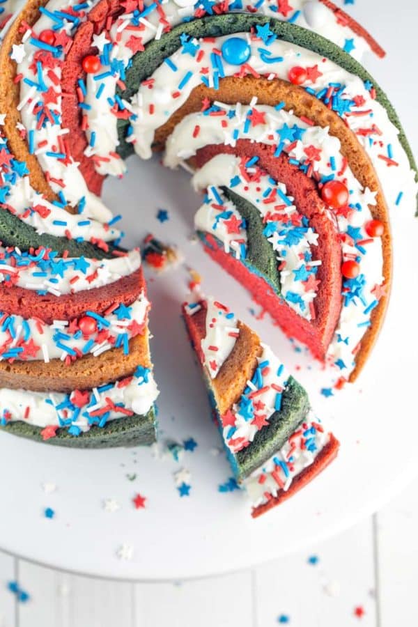 Red White and Blue Bundt Cake: This star-spangled patriotic spiral bundt cake will be the talk of your 4th of July Party! Decadent buttery vanilla cake in a perfectly colored spiral . USA! USA! {Bunsen Burner Bakery}