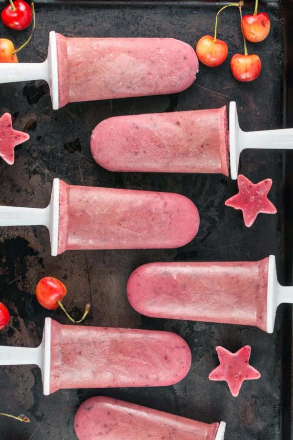 Watermelon Cherry Popsicles: only 4 ingredients and 5 minutes necessary for creamy, fruity popsicles made from pureed fresh fruit and yogurt. The perfect refreshing summer dessert! {Bunsen Burner Bakery}