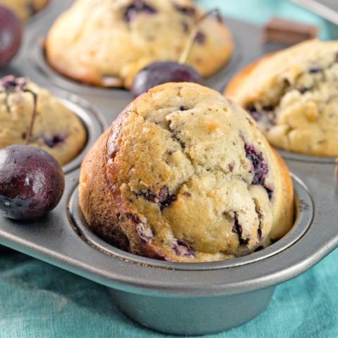 Cherry Chocolate Chunk Muffins: One bowl, mix by hand, filled with fresh cherries and dark chocolate chunks. The perfect summertime sweet treat! #bunsenburnerbakery #muffins #cherry #cherries #chocolatecherry