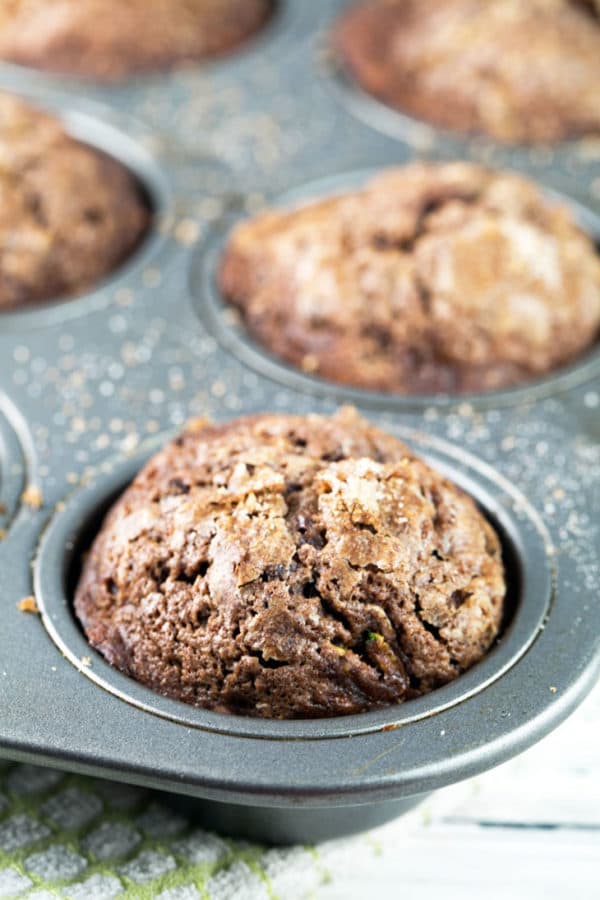 Streusel Topped Chocolate Zucchini Muffins: extra moist with a crackly topping and packed full of zucchini, these muffins are the most delicious way to eat your veggies! Freezer friendly and perfect to share! {Bunsen Burner Bakery}