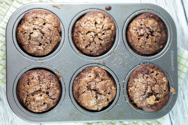 Streusel Topped Chocolate Zucchini Muffins: extra moist with a crackly topping and packed full of zucchini, these muffins are the most delicious way to eat your veggies! Freezer friendly and perfect to share! {Bunsen Burner Bakery}
