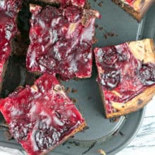 Cherry Cheesecake Brownies: made entirely from scratch with thick, fudgy brownies, a creamy layer of cheesecake batter, and homemade cherry pie filling on top. {Bunsen Burner Bakery}