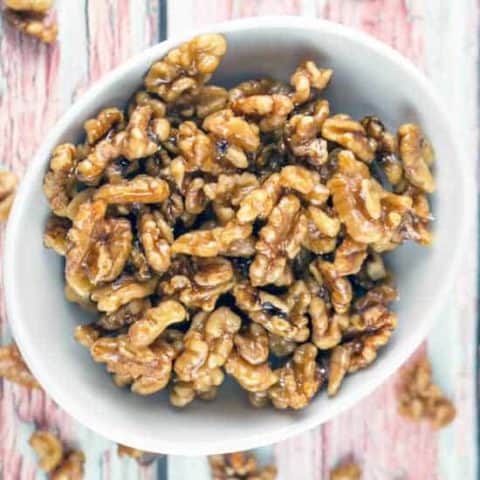Maple Glazed Walnuts: An easy 5 minute, 4 ingredient recipe for gluten free and vegan toasted walnuts glazed with maple syrup. Perfect for a snack, topping a salad, or embellishing a dessert all year long. #bunsenburnerbakery #walnuts #candiednuts #glutenfree #vegan #paleo