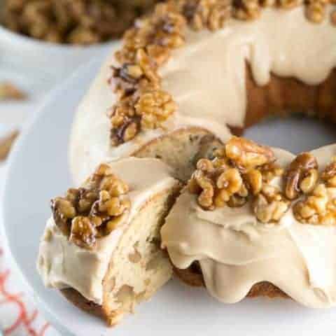 Maple Walnut Bundt Cake: vanilla bundt cake filled with maple and walnut, a thick layer of maple frosting, topped with homemade maple glazed walnut. It's the perfect fall cake! #bunsenburnerbakery #bundtcake #cake #maplewalnut #fallbaking