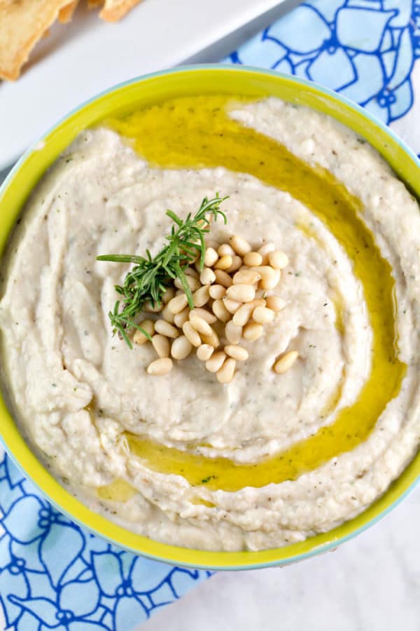 creamy garlic white bean dip with pine nuts and rosemary