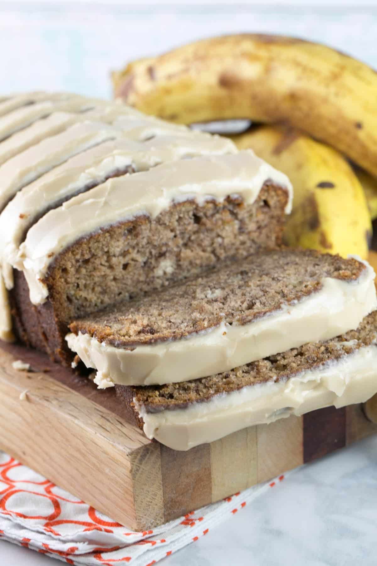 straight on photo of sliced banana bread with a maple glaze