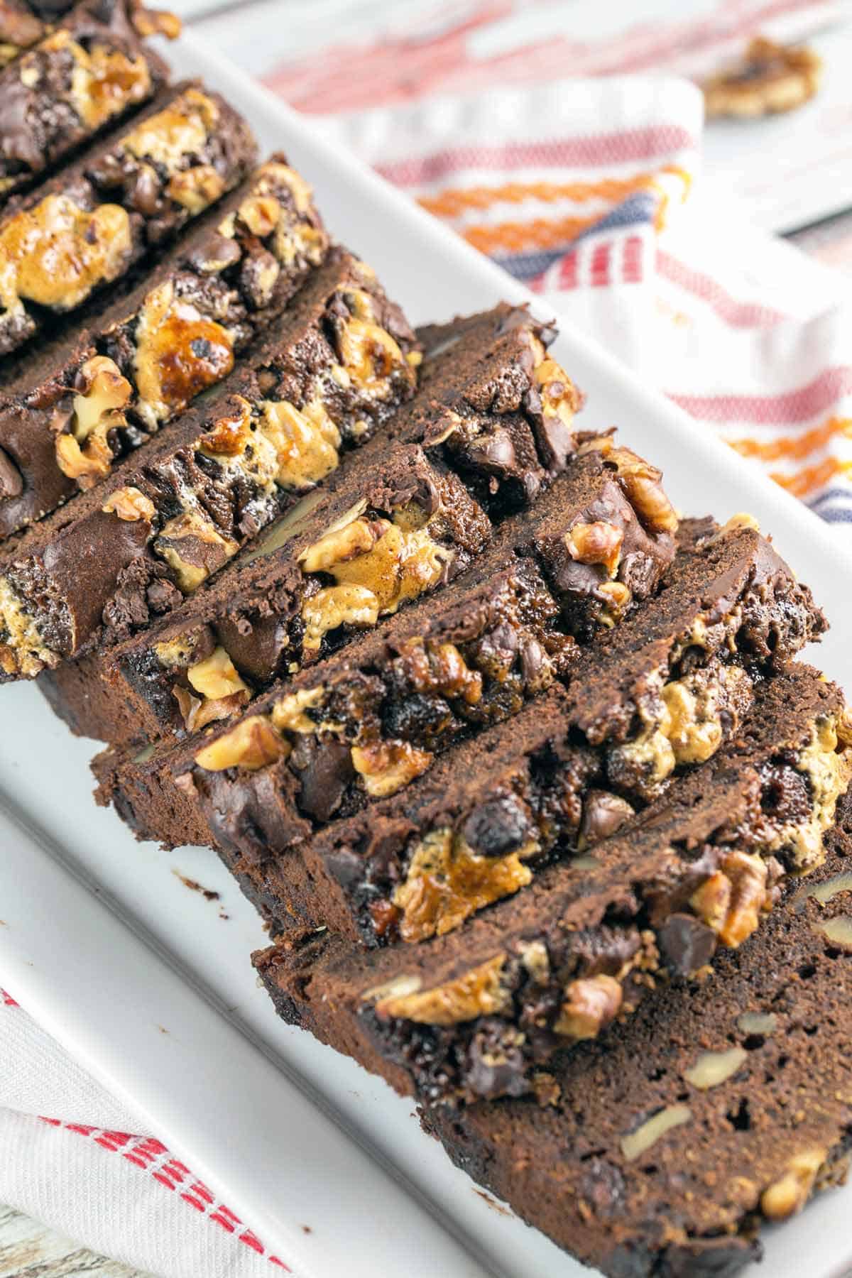 slices of rocky road banana bread arranged on a white serving dish