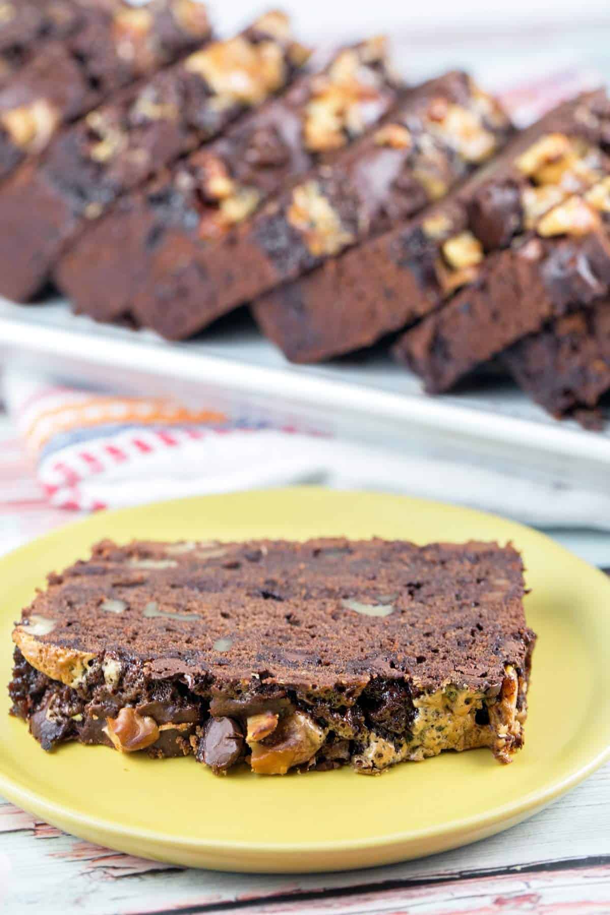 one slice of rocky road banana bread on a yellow plate