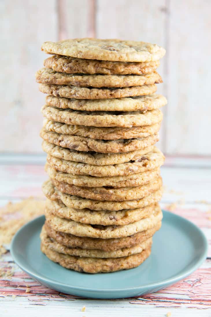 18 toffee cookies stacked tall on a dessert plate.