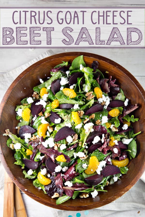 Roasted Beet Salad with Mandarin Oranges and Goat Cheese: a bright and festive salad full of spinach, mandarin oranges, goat cheese, candied walnuts, and beets.