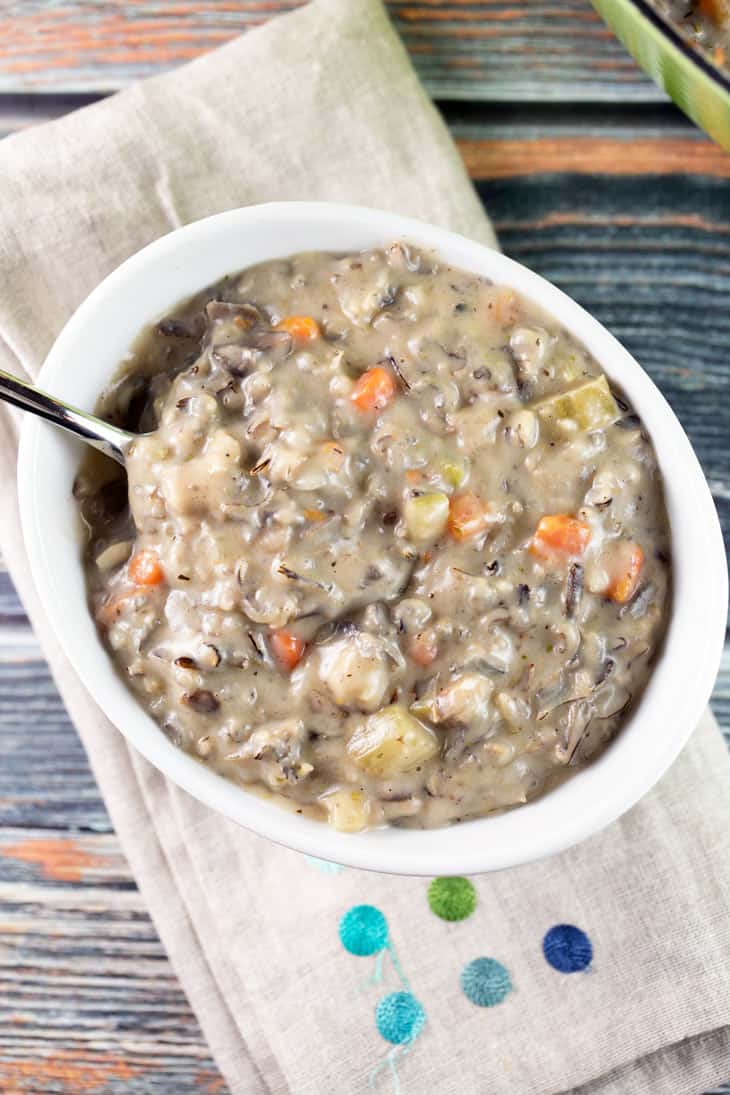 white bowl on a burlap towel filled with mushroom soup.