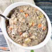 white bowl filled with mushroom and wild rice soup.