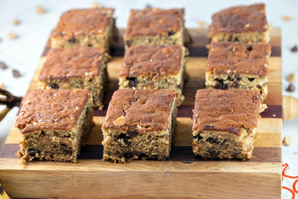 Peanut Butter Chocolate Chip Banana Bars: banana bread meets blondie meets sheet cake, these banana bars are full of chocolate and peanut butter chips. Easy to bake and perfect to share, in less time than banana bread. {Bunsen Burner Bakery}