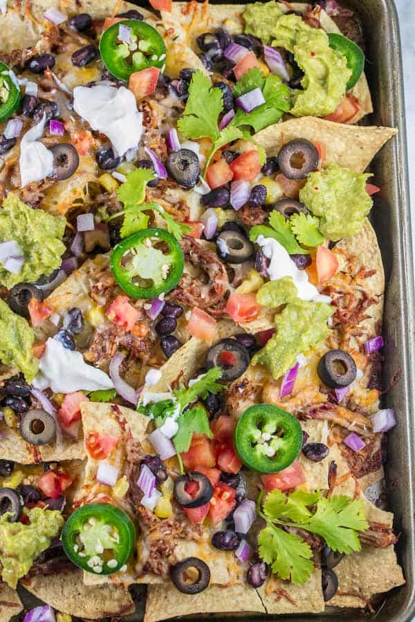 Sheet Pan Nachos: the ultimate loaded nachos are just 10 minutes and one sheet pan away. Easy entertaining - perfect for parties... or dinner! {Bunsen Burner Bakery} #nachos #appetizers #partyfood #superbowl