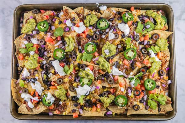 Sheet Pan Nachos: the ultimate loaded nachos are just 10 minutes and one sheet pan away. Easy entertaining - perfect for parties... or dinner! {Bunsen Burner Bakery} #nachos #appetizers #partyfood #superbowl