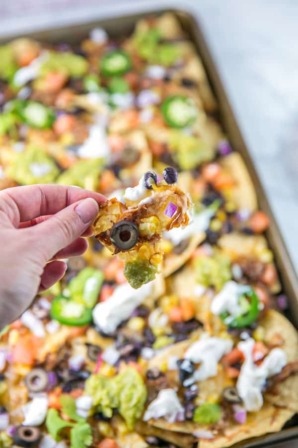 Sheet Pan Nachos: the ultimate loaded nachos are just 10 minutes and one sheet pan away. Easy entertaining - perfect for parties... or dinner! {Bunsen Burner Bakery} #nachos #appetizers #partyfood #superbowl