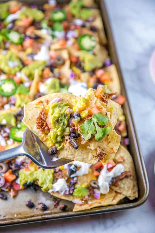 Sheet Pan Nachos: the ultimate loaded nachos are just 10 minutes and one sheet pan away. Easy entertaining - perfect for parties... or dinner! {Bunsen Burner Bakery} #nachos #appetizers #partyfood #superbowl