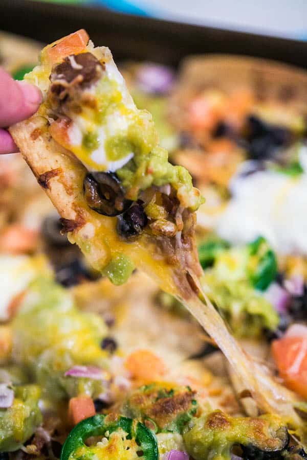 Sheet Pan Nachos: the ultimate loaded nachos are just 10 minutes and one sheet pan away. Easy entertaining - perfect for parties... or dinner! {Bunsen Burner Bakery} #nachos #appetizers #partyfood #superbowl