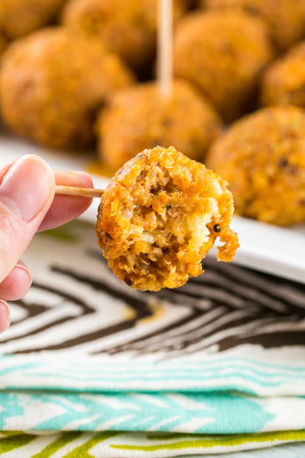 Spicy Buffalo Quinoa Bites: the perfect vegetarian and gluten-free appetizer for your football party or tailgate! Crispy quinoa surrounding a melted cheesy center, covered in spicy buffalo sauce. A hit with both meat eaters and vegetarians alike! {Bunsen Burner Bakery} #vegetarian #glutenfree #superbowlparty #appetizers