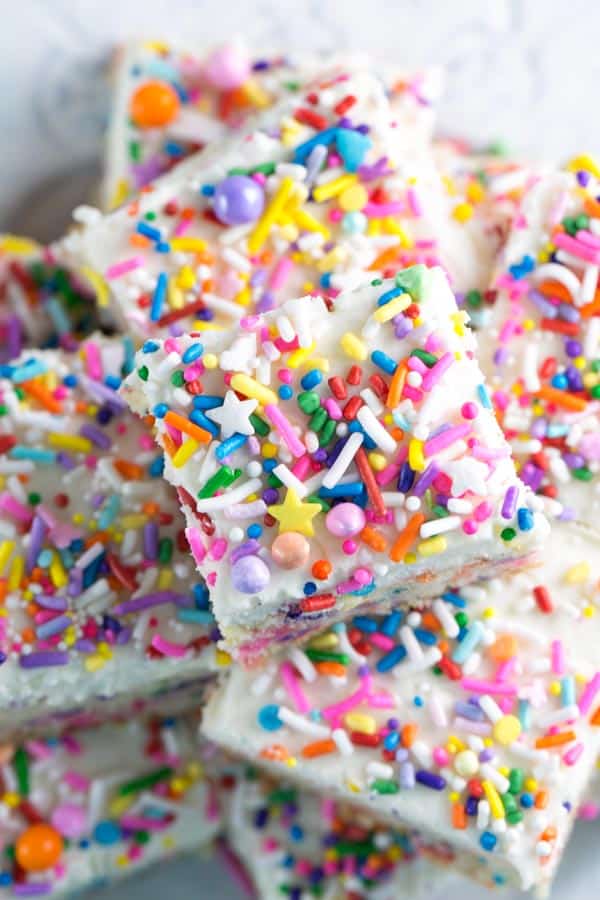 Sprinkle Sugar Cookie Bars: soft and sweet frosted cookie bars, perfect for any celebration! {Bunsen Burner Bakery} #cookies #cookiebars #sugarcookies #sprinkles