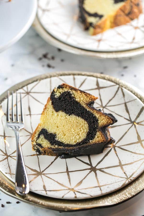 slice of vanilla bundt cake swirled with dark chocolate.