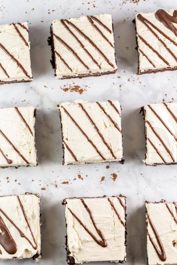 square brownies covered with tahini buttercream and drizzles of chocolate