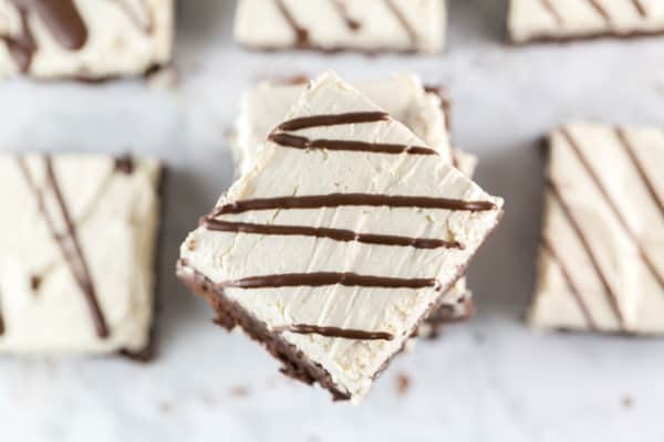 square brownie angled opposite other brownies in a large stack.