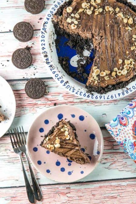 No Bake Nutella Pie: it doesn't get any easier than this four ingredient no bake nutella pie filling, served in a crispy oreo cookie crust. Fancy enough for a special occasion, easy enough for a weeknight. {Bunsen Burner Bakery} #pie #nutellapie #nutella #nobake