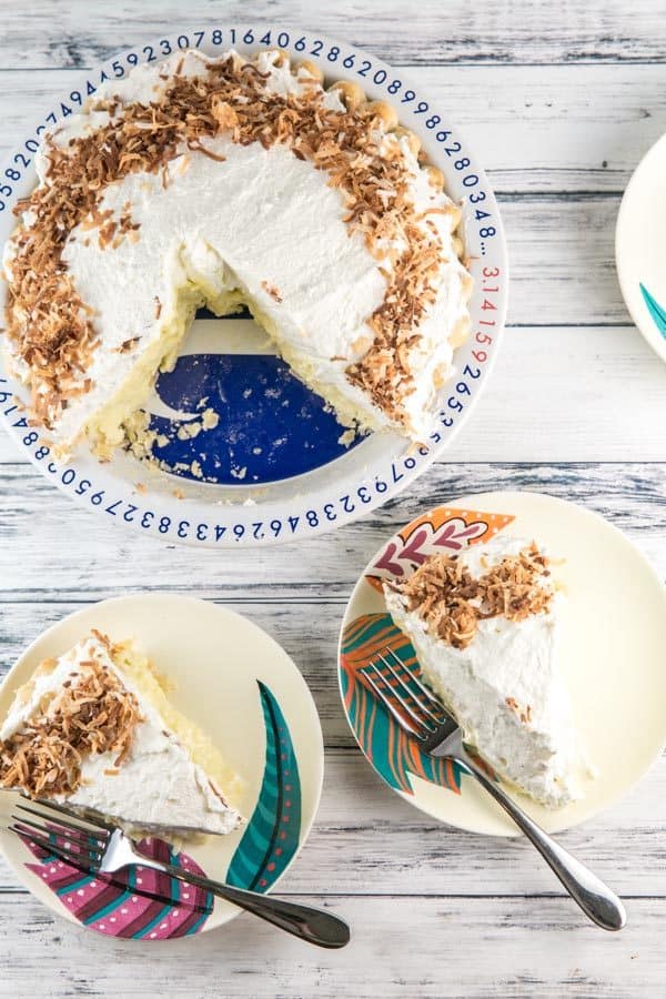 Coconut Cream Pie: packed full of triple coconut flavor and a sky-high pile of whipped cream. Perfect to celebrate spring and Easter! {Bunsen Burner Bakery} #pie #coconutcreampie #easter #coconut