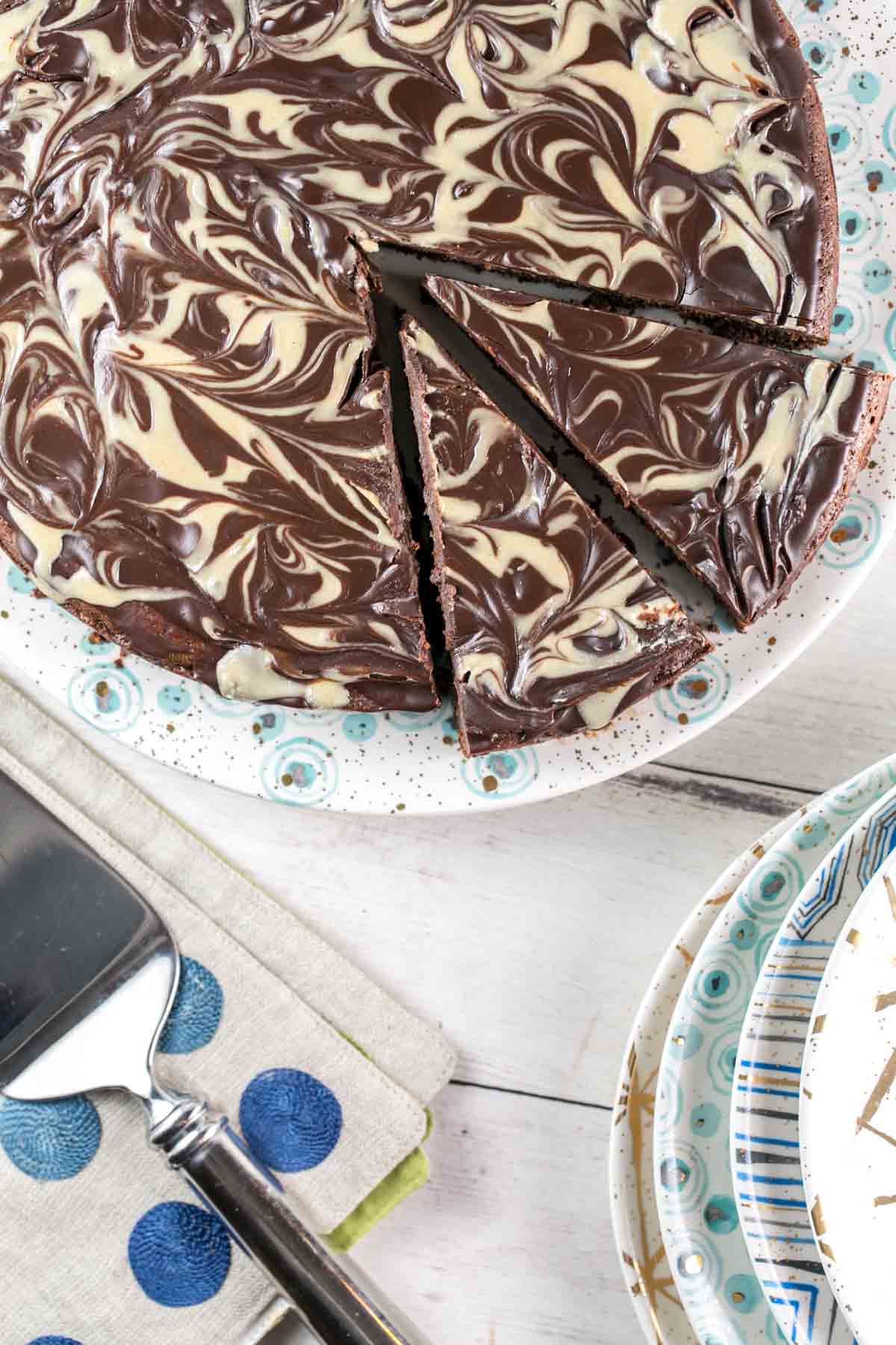 flourless cake baked in a springform pan with two slices cut