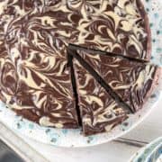 flourless chocolate cake covered with beautiful swirls of tahini