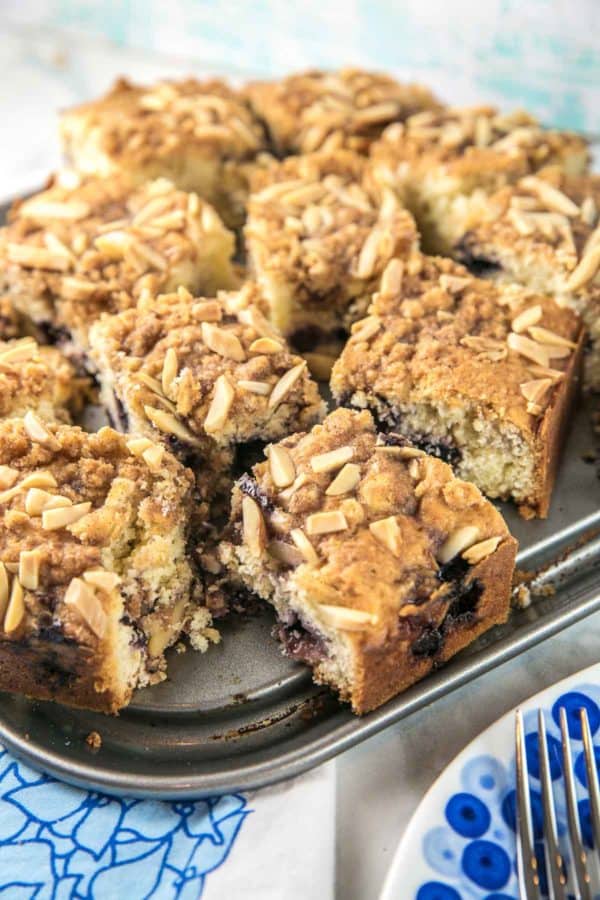 side view of squares of blueberry buttermilk coffee cake with an almond streusel 