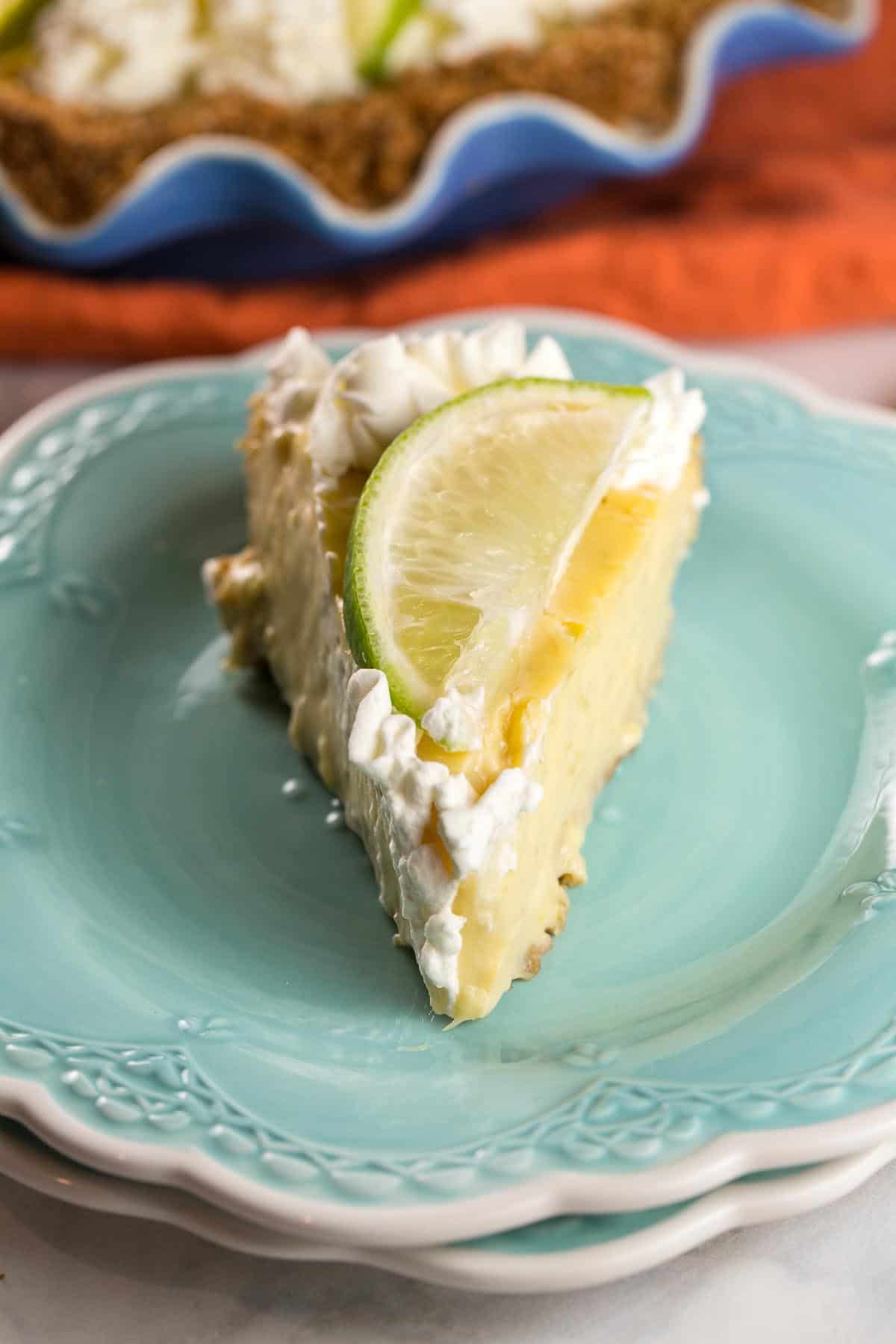 front view of a triangular slice of pie with a soft, fluffy custard-like texture