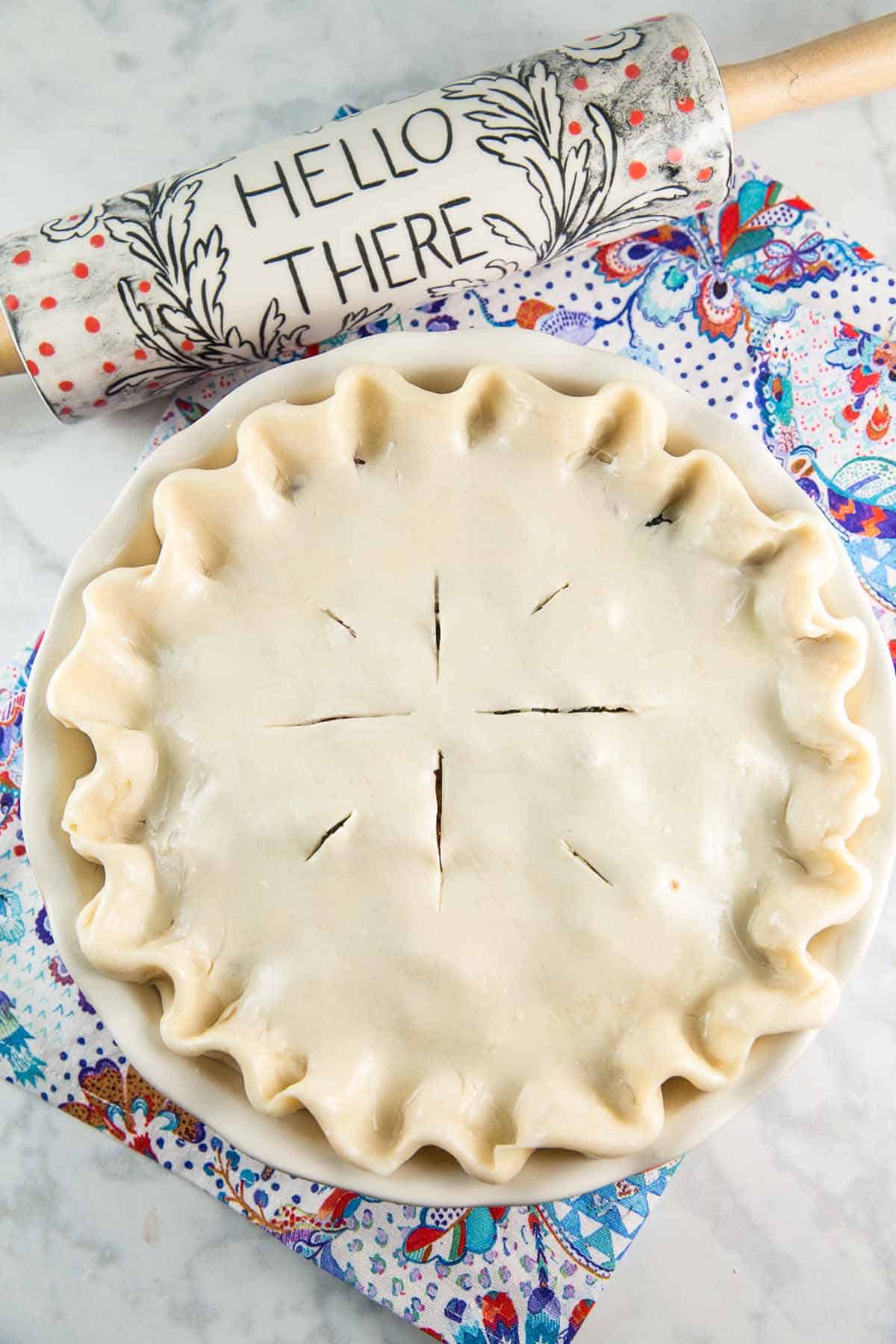 double crust pie filled with blueberry and rhubarb before baking