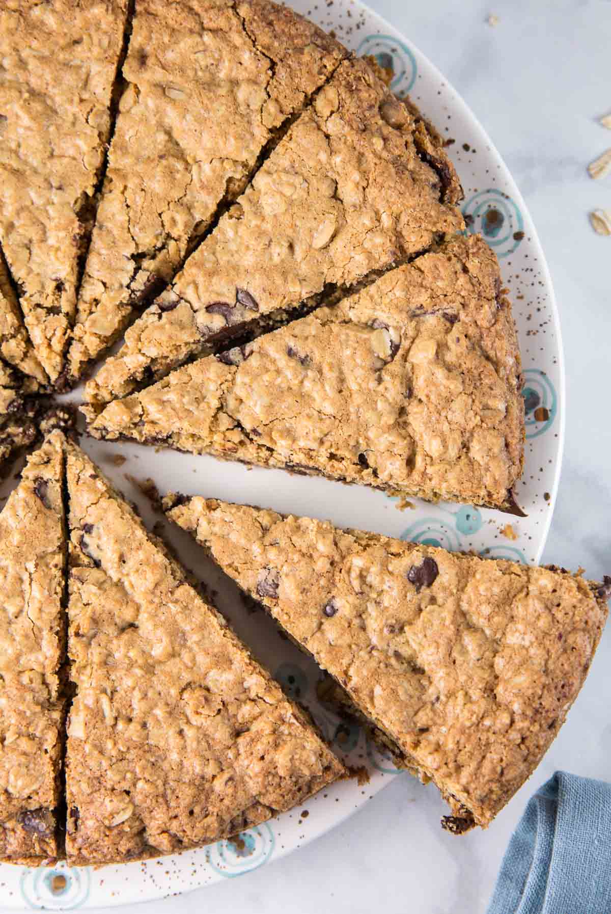 giant oatmeal chocolate chip cookie cut into thin wedges